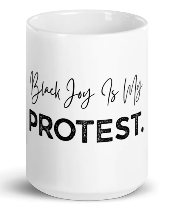 White mug with 'Black Joy Is My Protest' text on a white background