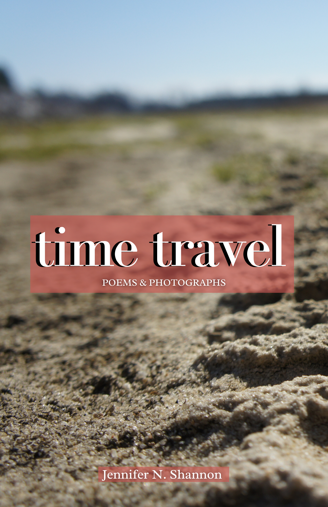 Book cover of 'time travel' with poems and photographs by Jennifer N. Shannon, featuring a blurred natural background.